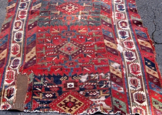 Kurdish/Anatolian fragment, early 19th Century or before, 38" by 46", with an extraordinary array of saturated colors.  Reddish wool wefts, white cotton warps.  Photos taken outside in mostly sunny conditions.  ...