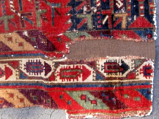 Kurdish/Anatolian fragment, early 19th Century or before, 38" by 46", with an extraordinary array of saturated colors.  Reddish wool wefts, white cotton warps.  Photos taken outside in mostly sunny conditions.  ...