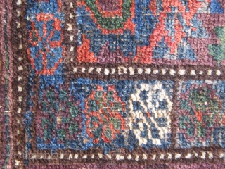 Antique S.E. Persian Baluch balisht, with lovely colors including a good deal of green and aubergine.  Original edges, bottom end slightly reduced.  32" by 24".      
