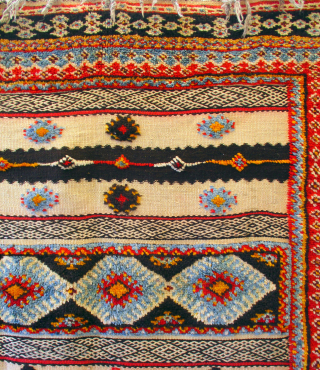 MOROCCAN BERBER MIXED TECHNIQUE RUG known as a handira. It is a mixture of piled woven sections and bands of embroidered kilim weave. This is a common mix for Berber rugs of  ...