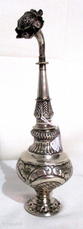 ANTIQUE SILVER ROSE WATER SPRINKLER from the Ottoman period of about 1850 in Constantinople. These delicate silver vessels were filled with rose petal scented water which was poured on the hands of  ...