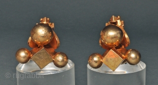 This pair of gold ear ornaments are known as pampadam, They are worn in the earlobe by women of certain south Indian communities. They would be worn with one or two others  ...