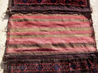 Antique complete large Baluch saddlebag with silky pile and fine weave. No repairs. few little dots of moth nibbles, otherwise, the pile is uniform and high. sides are original.Approximate size is 5'  ...