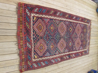 Good Antique Lori South West Persian Long rug. Good pile and great colours. 9 ft 9 inches x 5 ft 2 1/2 inches. 297 x 159 cm. SOLD     