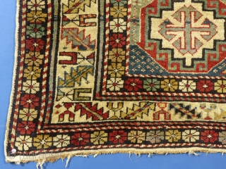 Caucasian Moghan or Shirvan(?),c.1875-1900,
 70" X 39",
It has been used and shows signs of wear.
There are NO holes.
The main damage is along the one edge where there are 3 rough spots.
It has  ...