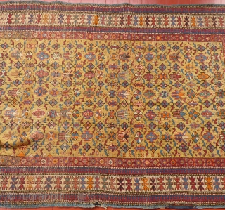 This is a great Caucasian Kuba.
It has a beautiful gold colored field and nice design.
However, it does have it's share of problems.
Both end areas have damage and very poor repairs.
The pile is  ...