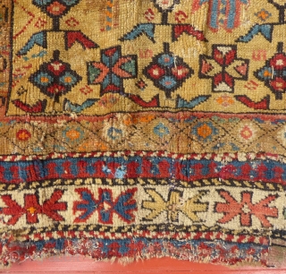This is a great Caucasian Kuba.
It has a beautiful gold colored field and nice design.
However, it does have it's share of problems.
Both end areas have damage and very poor repairs.
The pile is  ...