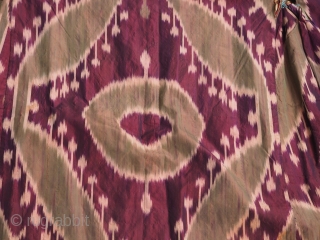 Uzbek allsilk ikat chapan.Late 19th century. Sleeves 62in lenght 50 inches (158 x 127 cm) Four colors.Lined with cotton Russian block print.Excellent condition. No stains, tears or holes.     