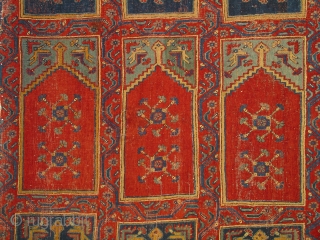 Ushak region carpet fragment of a large mosque prayer carpet with three rows of three prayer niches, late 18th century, 400cm high and 245cm wide. Condition: good overall even pile.
Compared to most  ...