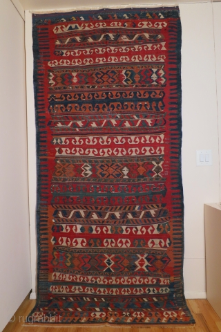 Anatolian kilim,Yuncu tribes, Balikesir region, circa 1800-1850, 51 x 116 inches (130 x 295cm) with a rare multiband design, professionally cleaned with minor restorations throughout the kilim.      