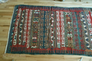 Anatolian kilim,Yuncu tribes, Balikesir region, circa 1800-1850, 51 x 116 inches (130 x 295cm) with a rare multiband design, professionally cleaned with minor restorations throughout the kilim.      