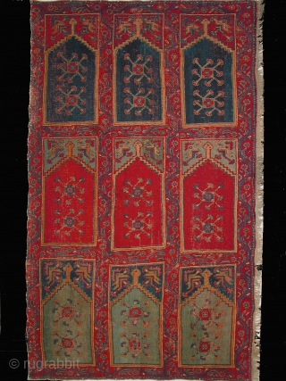 Ushak carpet fragment from a large mosque prayer carpet with three rows of three niches, late 18th century, 400-245cm, overall even pile; one small hole has been repaired. Compared to other Ushak  ...