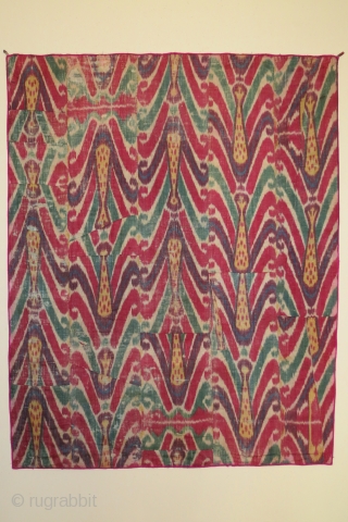 Uzbek ikat wallhanging, silk warp, cotton weft, 19th century, 46 x 58 inches, lining of hand spun hand woven cotton with a stamped or resist dyed design. The many fabric pieces comprising  ...