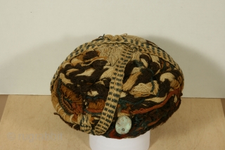 Pre-Columbian woven and plaited turban of alpaca wool, early Arica culture, Chile, circa 1000BC-0 AD, 9 inches across and 4 inches high. In excellent condition without any stains or losses. The turban  ...