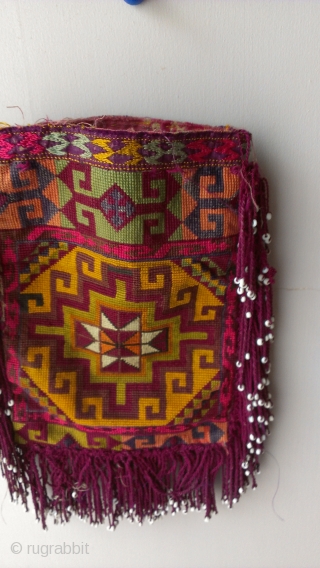 This is a turkmen bag that some people were using it for coins, tobacco, mirror or wooden comb however these kinds of pieces are usually made for dowry so it was made  ...