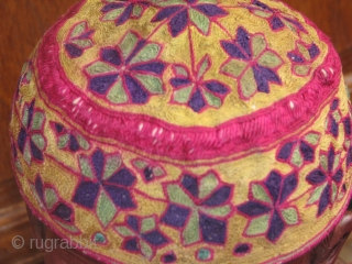 This beautiful hand stitched silk on cotton hat is an early turkmen piece,very fine work and it's a child hat             