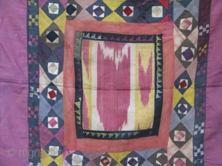 This is an old koraq(patch work)with a silk ikat in the middle part, uzbek tribe from northern Afghanistan,was used as a mirror cover(aenah posh)in the old days,
still in a very good condition. 