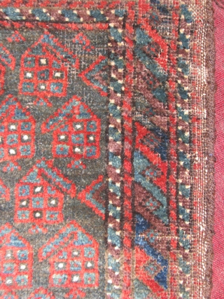 This is an real old beluch balesht with boteh design, all natural colors and the backing has also been decorated with nice designs, the original goat hair wrapping is tacked all around.  ...