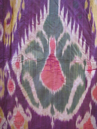 This is a very old ikat with a nice red cotton and green silk border backing superb colors front and back            