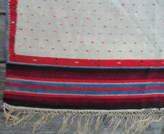 Antique Mexican Serape -Wool on Linen -74" by 38" This is a Saltillo style serape where the diamond center is an aggregate of four diamonds on a spot-repeat field with zigzag borders.
The  ...