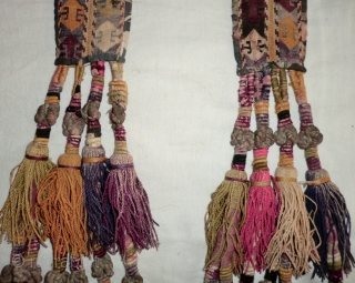 Pair of Uzbek Lakai Tassels. 
Very nice pair of Lakai tassels on cross stitched panels. The tassel knots are bound in metal thread.

They each measure 2-1/2" by 23"     