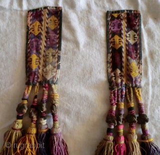 Pair of Uzbek Lakai Tassels. 
Very nice pair of Lakai tassels on cross stitched panels. The tassel knots are bound in metal thread.

They each measure 2-1/2" by 23"     