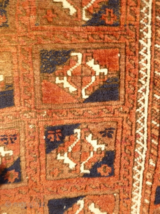 Baluch Rug with Turkmen motifs. Size 6 feet 4 inches x 3 feet 4 inches. Soft, even pile, corrosion to browns, losses to ends, slevedges worn- see photos. Finely woven wool on  ...