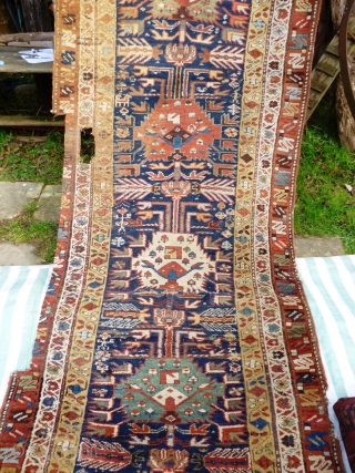 North West Persian Runner. Fragmented: missing outer border section, heat related damage in same area. Otherwise full pile with minimal damage. Good colours and interesting anthropomorphic motifs - see photos. Needs a  ...