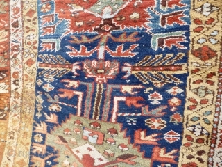 North West Persian Runner. Fragmented: missing outer border section, heat related damage in same area. Otherwise full pile with minimal damage. Good colours and interesting anthropomorphic motifs - see photos. Needs a  ...