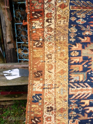 North West Persian Runner. Fragmented: missing outer border section, heat related damage in same area. Otherwise full pile with minimal damage. Good colours and interesting anthropomorphic motifs - see photos. Needs a  ...