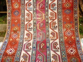 Caucasian Karabagh or Gengie. Distressed state - low pile and very worn areas - see photos. Great funky colours and palate.

Wool on wool
Size: 9' 3" x 4'      