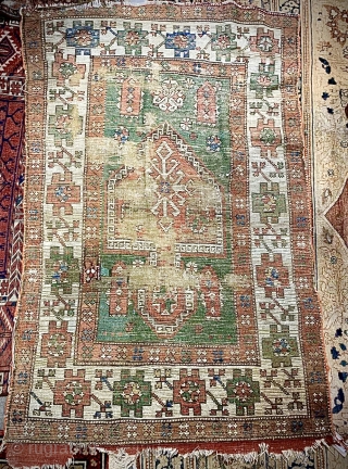 Old Yuntdag Bergama Turkish prayer rug. Worn, re-weaves, sides reduced. Size: 141 x 87cm. Free Postage within UK.
For international postage please ask           