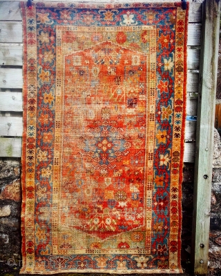 Ushak double-niche Rug. Approx 200cm x 125cm. Heavy wear in places. Sides and ends (folded over and taped) original. No repair or restoration. Contact me for further pictures. Lovely palette: ultramarine border,  ...