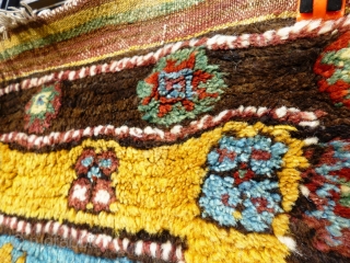 This rare rug made in a village in the Çal region of South West Anatolia used to serve as a sleeping rug and is thus a "yatak". 

The very coarse wool weave  ...