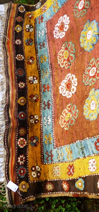 This rare rug made in a village in the Çal region of South West Anatolia used to serve as a sleeping rug and is thus a "yatak". 

The very coarse wool weave  ...
