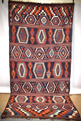 Veramin ‘ghileem’ flat-woven wool carpet, central Persia, early 20th century, 11ft. 7in. x 5ft. 5in. 3.53m. x 1.65m Condition: Good, one or two small holes, no significant wear or damage.   