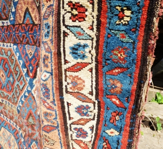 Kurdish rug. Wear to main ground with foundation showing in places. Sides need securing and tape has been added to reinforce them. Ends have been poorly secured. Great colours and a usable  ...