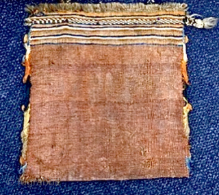 South West Persian ‘chanteh’ small bag size 35cm x 25cm approx. Condition: some wear to its edges, lower right corner with damage.           