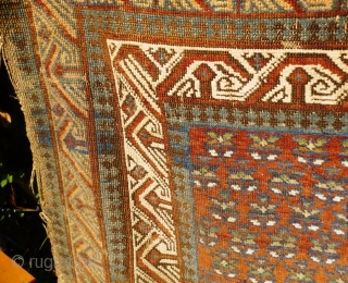 Ancient and charming little Caucasian Kuba rug with Seychour double border and dazzling abrashed main field with lattice of palmettes including pea green highlights. Original condition with a couple of tiny holes:  ...