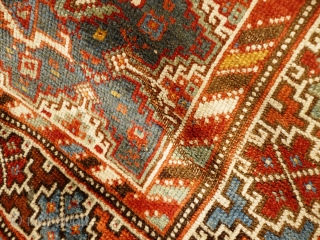 Colourful Khamseh 'chicken' carpet, 232 cm x 158 cm. Probably at least 100 years old with wonderful abrash in main field of different blues, nice greens in border. Two different yellows, one  ...