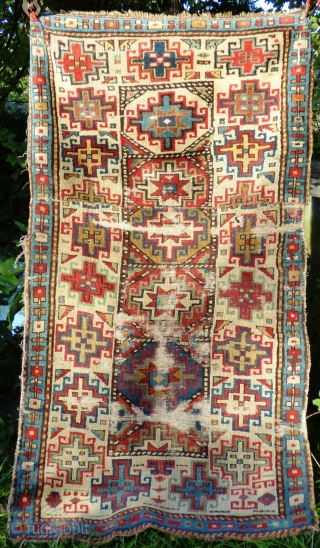 Fragmented Caucasian Moghan Rug, Memling Guls. Wool pile and warp, cotton wefts. 19th Century.

Size: 190cm x 102cm 6ft 3in x 3ft 4in. Just washed, no staining, uneven wear with full pile in  ...