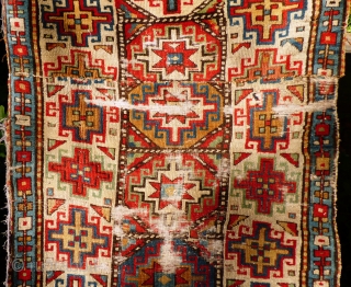 Fragmented Caucasian Moghan Rug, Memling Guls. Wool pile and warp, cotton wefts. 19th Century.

Size: 190cm x 102cm 6ft 3in x 3ft 4in. Just washed, no staining, uneven wear with full pile in  ...