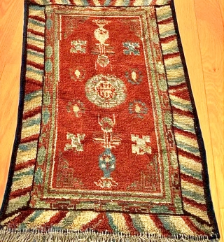 Chinese carpet with Turkestan motifs. Wool on cotton. Minor losses and re-piling in places, sides re-bound. Evidence of fuchsine. Overall full, even pile. Good colour. Affordable.
Size: 112cm x 72cm    