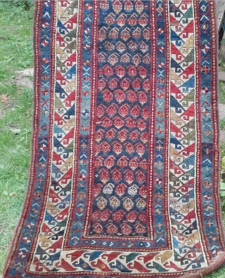 Caucasian Genje Boteh Long Rug, 19th Century. Original sides and ends, full pile, no restoration or repair. Great palette of vegetal colours, eveidence of fuchsine. Size: 8ft 1in x 3ft 7in 246cm  ...