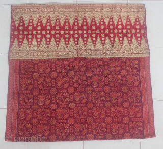 19th Century textile,Limar sarong from Palembang, Indonesia. Size: if the saroong opened will be 200cm x 105cm. Condition: the tumpal (gold thread area) has some damage and has been repaired. the ikat  ...