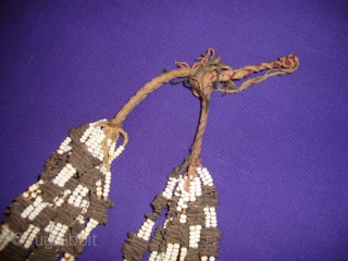 Pair of multi strand Tassels. Northern Afghanistan. 
Cloves, glass beads, silk and cotton. 
Length 50 cm.
Not 100% sure of origin or use. 
I was told they hung where food was prepared to  ...