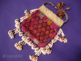 Nuristani embroidered drawstring bag / purse. 
Hand stitched silk on cotton.  14 x 16 cm.                 