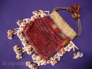 Nuristani embroidered drawstring bag / purse. 
Hand stitched silk on cotton.  14 x 16 cm.                 