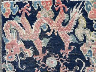 Getting ready for the year of the dragon….two charming Tibetan dragons playing with the wishfulfilling pearl.
Fine piece with great drawing. Condition as found with small repiled areas and some damage to the  ...