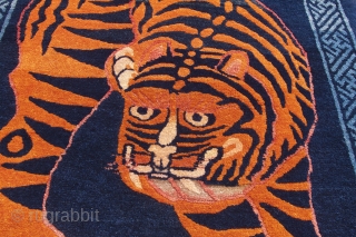 Period: 1920

Set against a dark indigo background, this tiger stands to attract attention. This powerful tiger is just turning around, ready to scare of any evil whilst maintaining a friendly attitude towards  ...